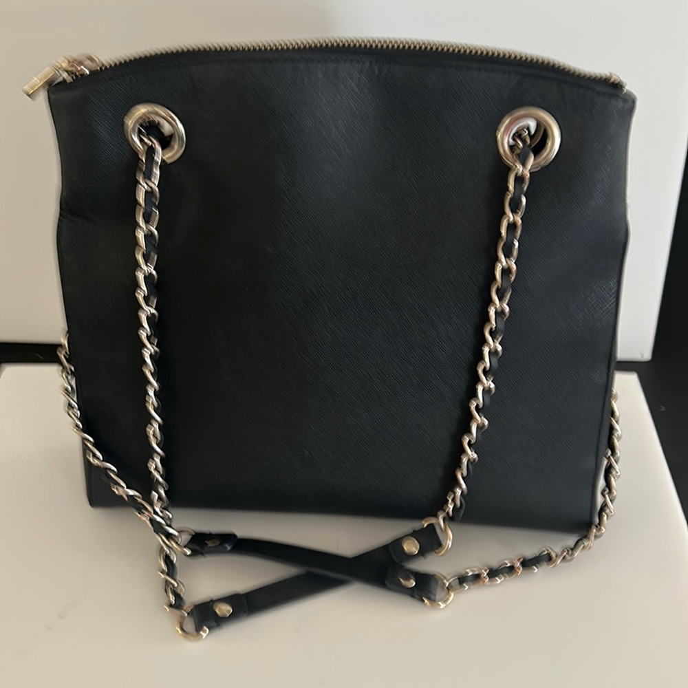 Black DKNY shoulder bag with chain handles.